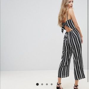 Black and white striped open back jumpsuit